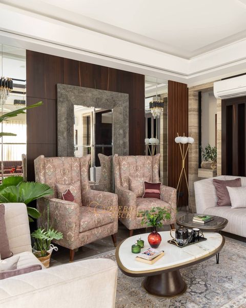 Nature-Inspired Elegance: A Living Room Oasis with Cream Accents and Lush Greenery - Architects in Gurugram